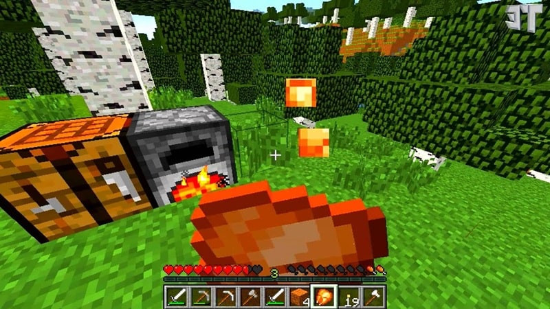 Người chơi Minecraft đang chế tạo một chiếc rìu gỗ trên bàn chế tạo, thể hiện quy trình khai thác và chế tạo cơ bản trong trò chơi
